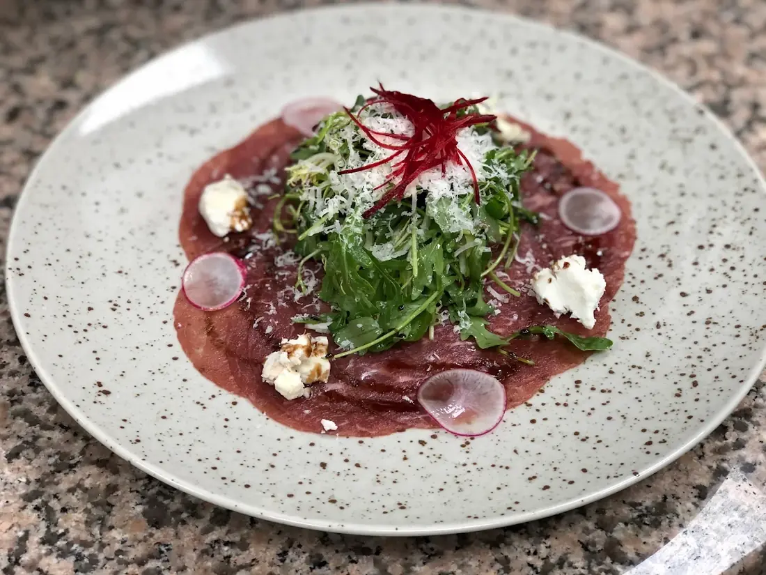 Beef carpaccio with rocket and parmesan