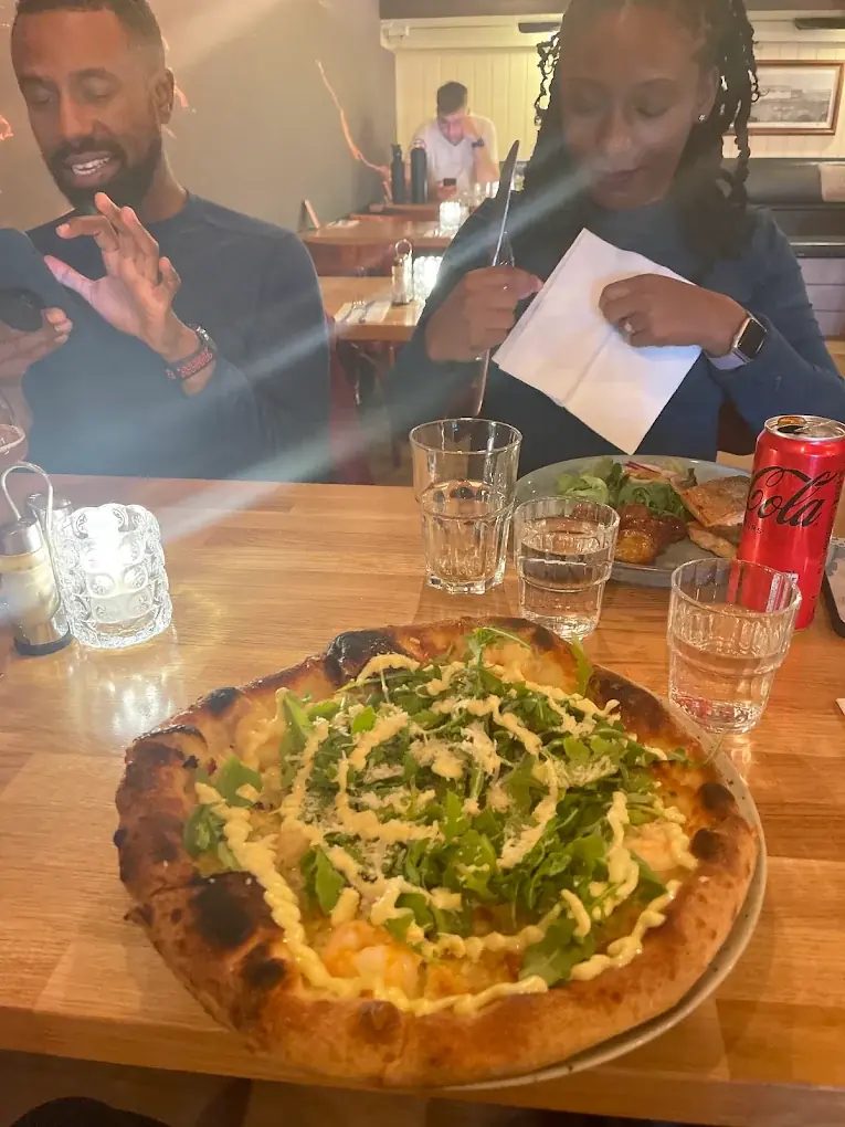 A seafood pizza with rocket