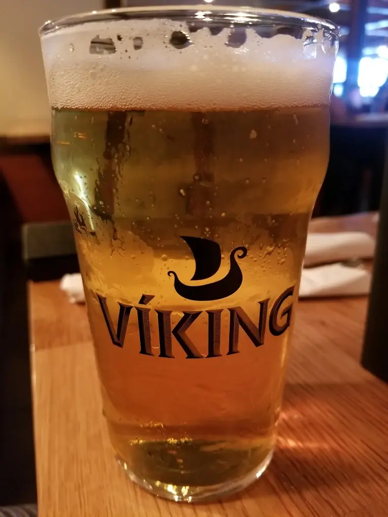 A glass of beer on the bar